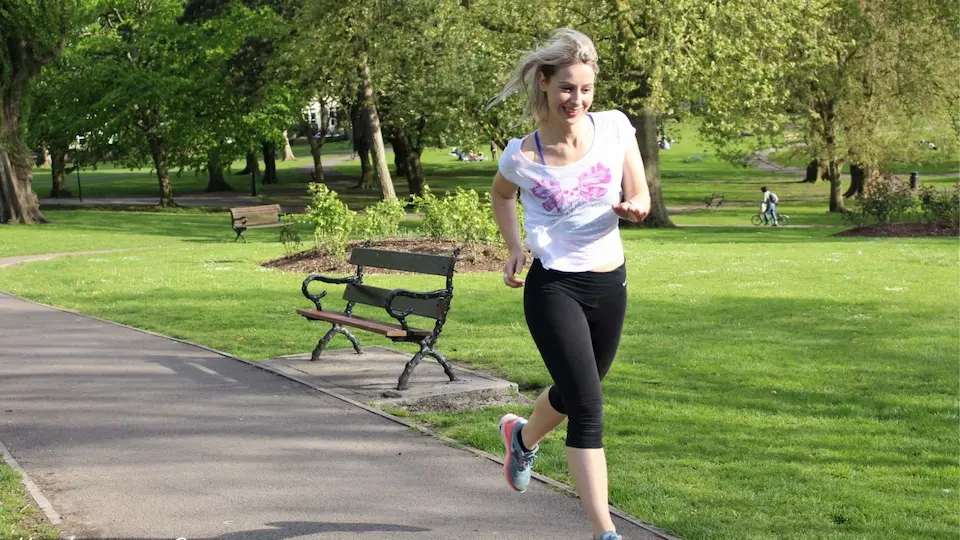 Grace Fitness founder Kathrine Grace jogging outdoors in Bristol, inspiring clients on their fitness journey